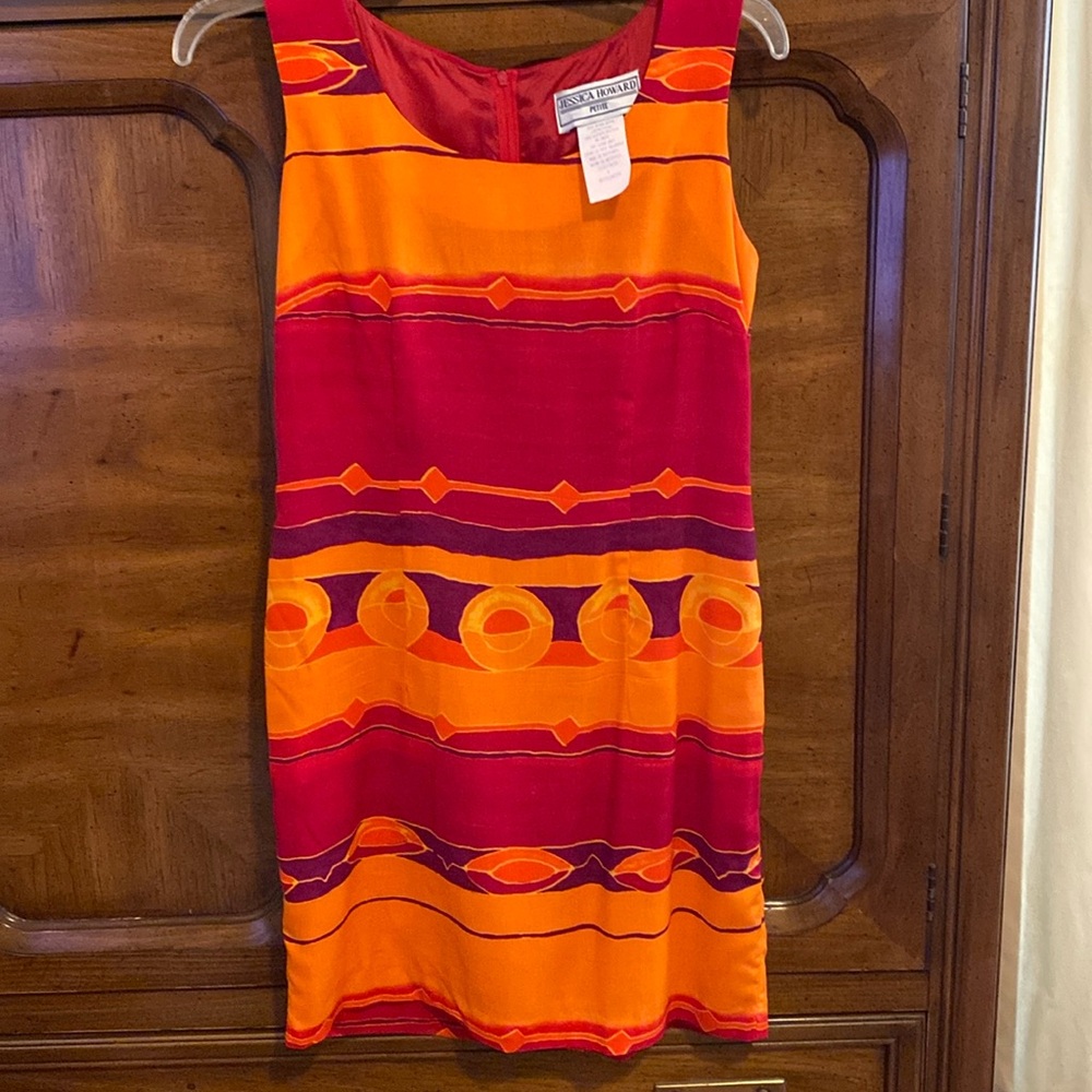 Sleeveless 100%rayon and dry clean only.